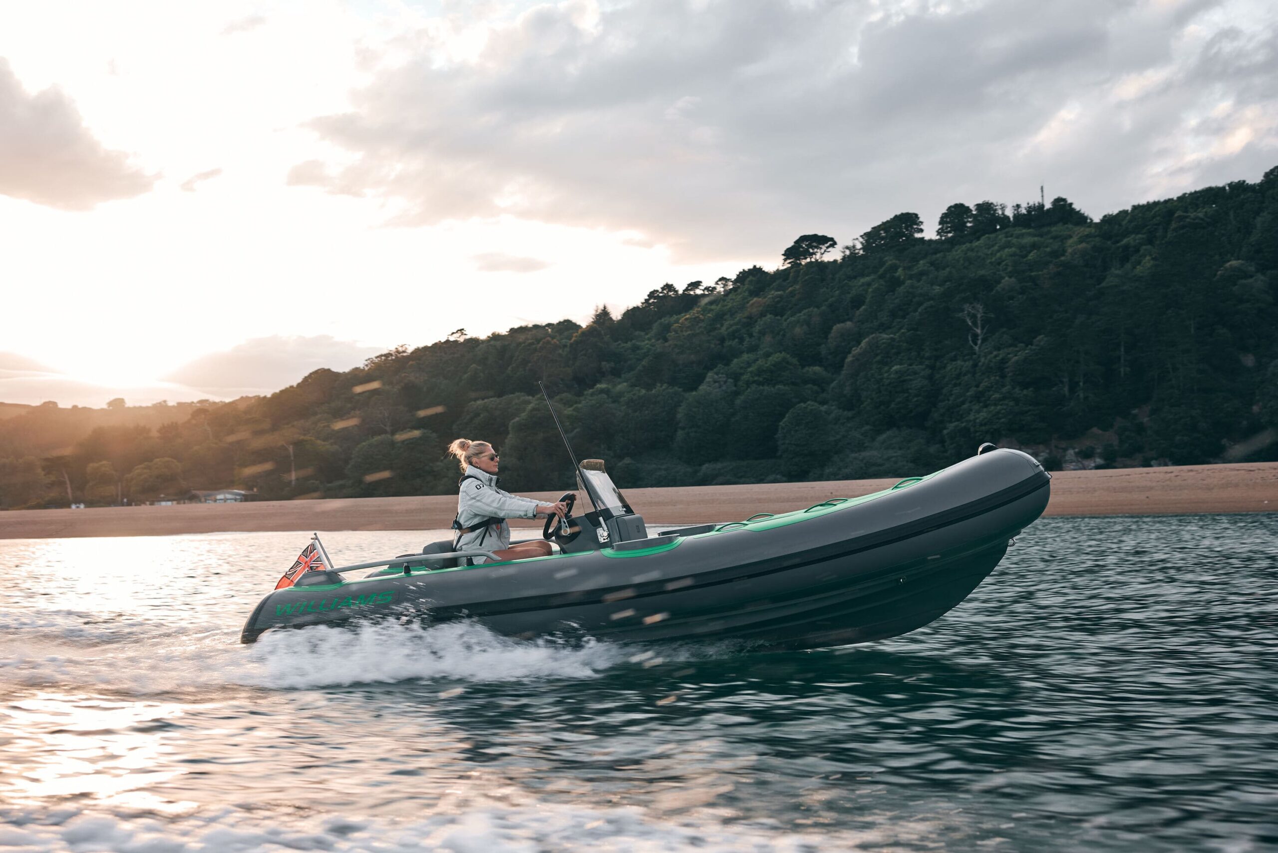 A couple on their SportJet Tender navigating through a rocky cave.